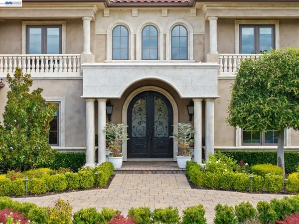 a front view of a house with garden