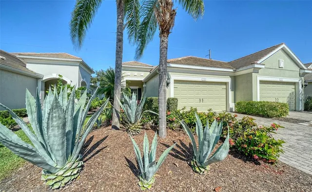 a view of a potted plants in front of house