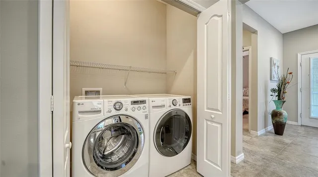 a view of hallway with washer and dryer