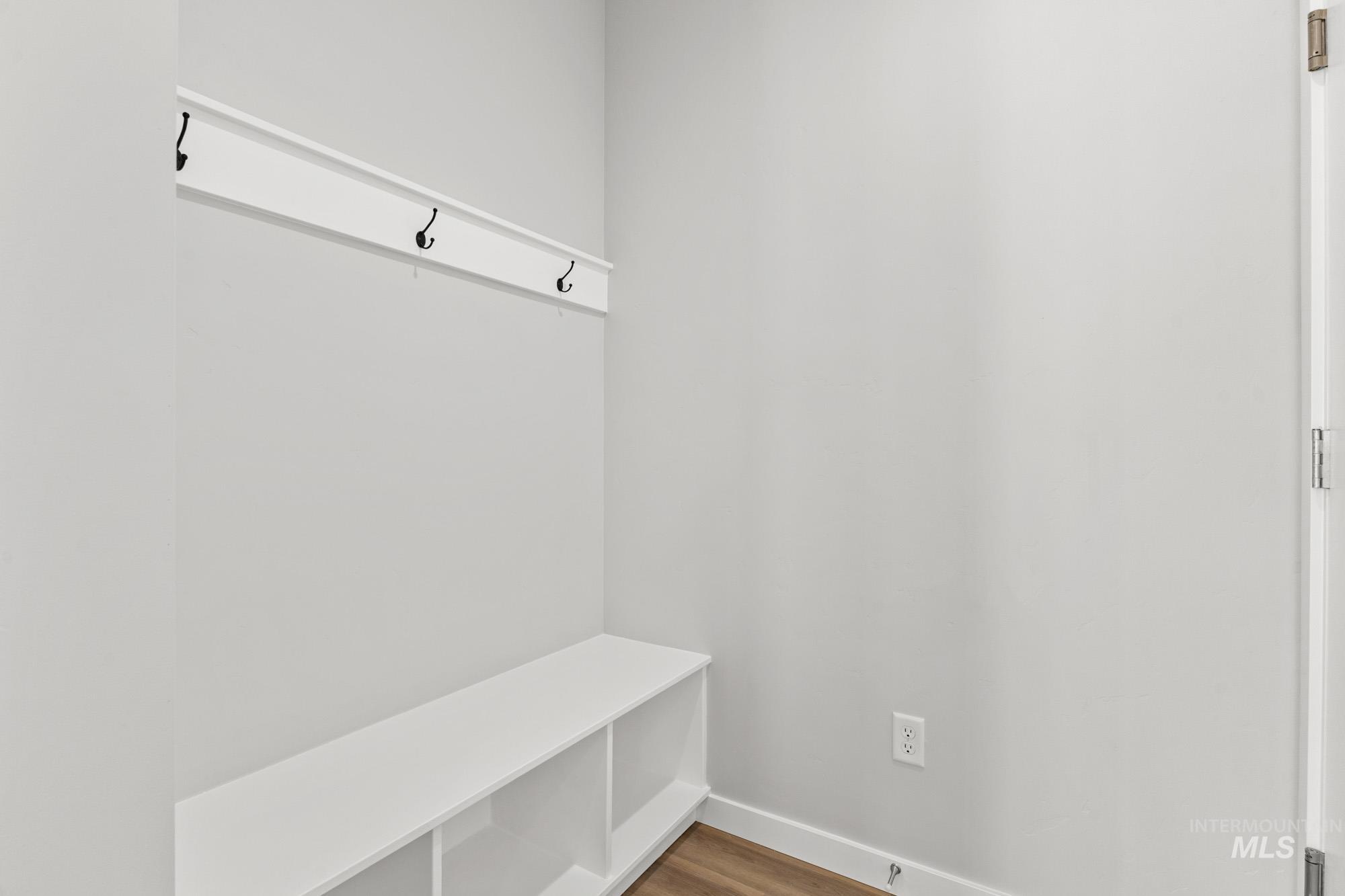 13713 Judson Street Caldwell, ID 83607 - Photo 10 of 24 Mudroom with wood finished floors and baseboards