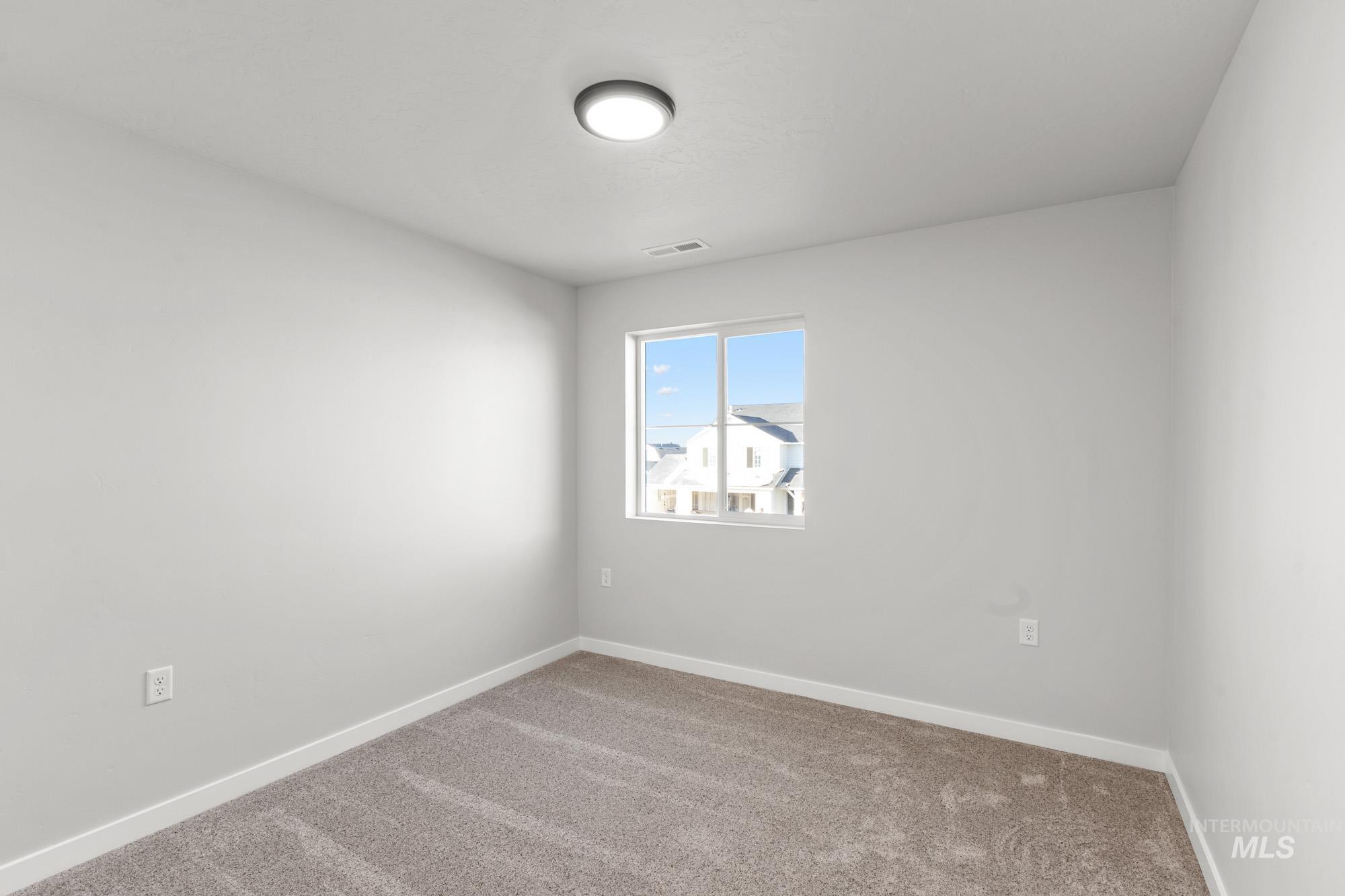 13713 Judson Street Caldwell, ID 83607 - Photo 14 of 24 Unfurnished room with baseboards and carpet
