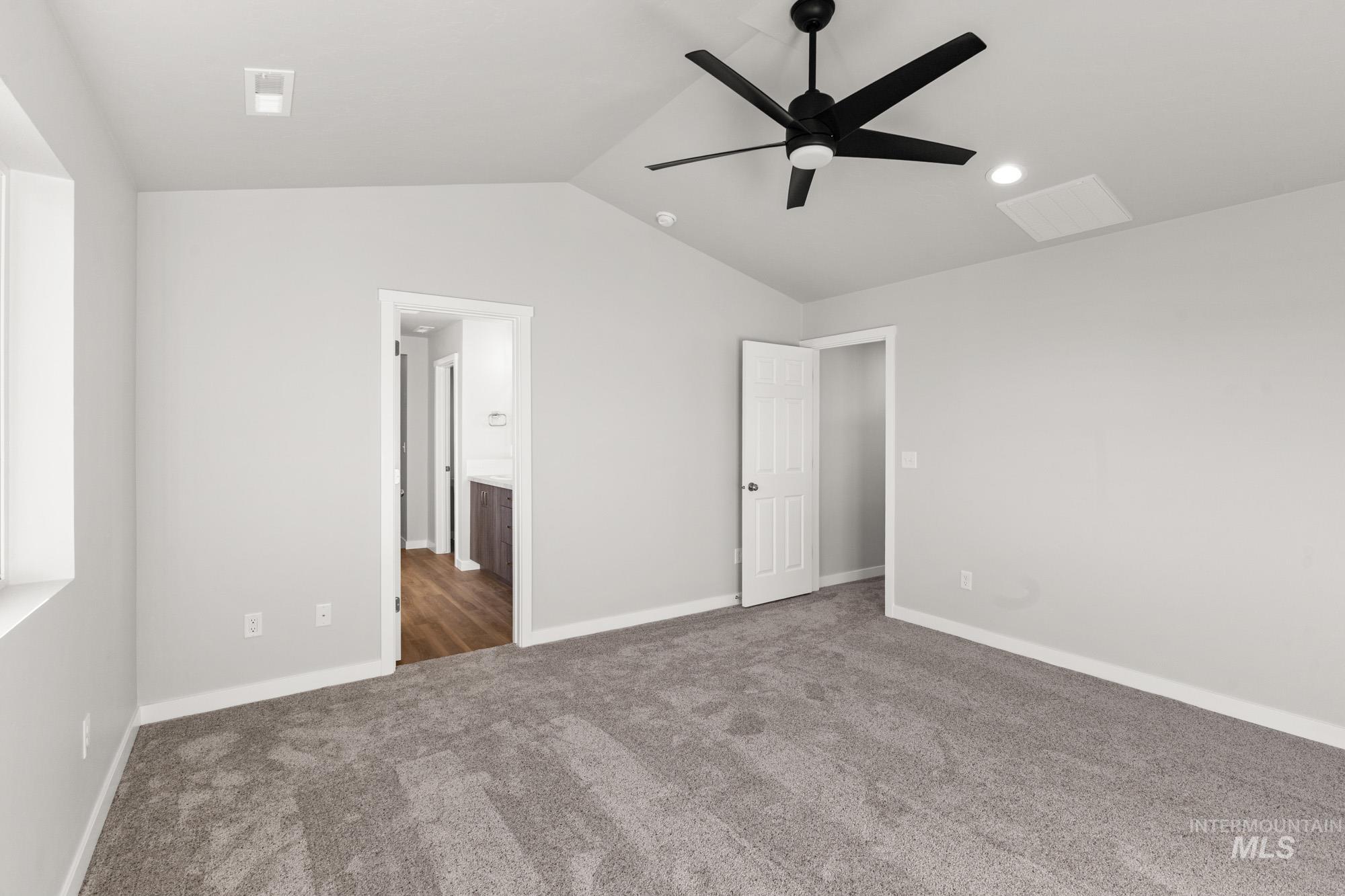 13713 Judson Street Caldwell, ID 83607 - Photo 19 of 24 Unfurnished bedroom featuring carpet, ensuite bathroom, and a ceiling fan