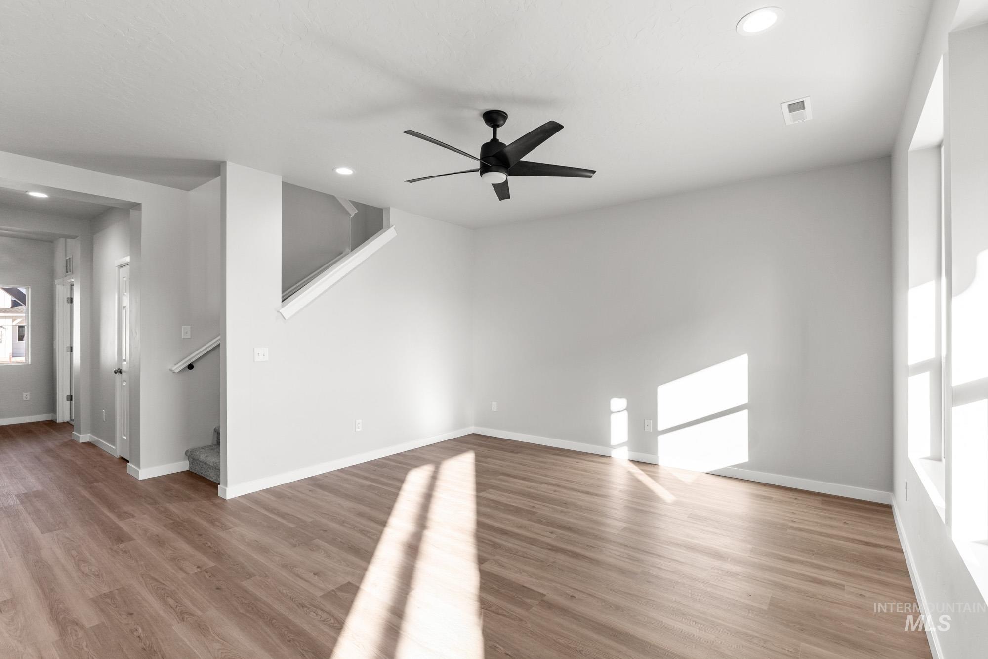 13713 Judson Street Caldwell, ID 83607 - Photo 8 of 24 Empty room featuring ceiling fan, light wood finished floors, and recessed lighting