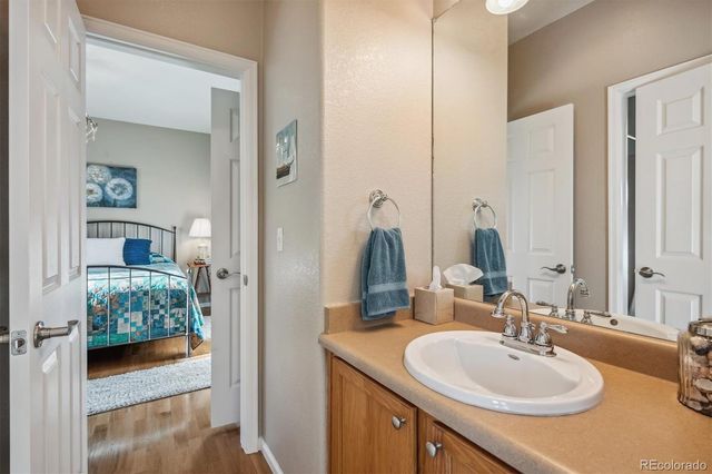 a en suite bathroom with a sink and a mirror