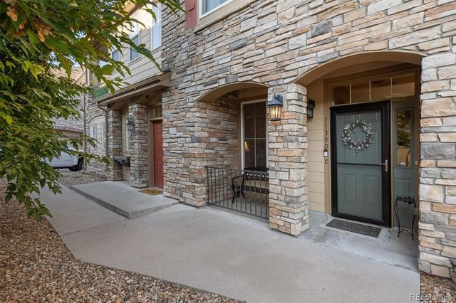 a view of a brick house with a large windows