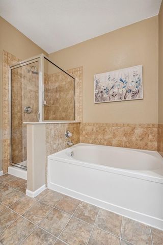 a bathroom with a bathtub and shower