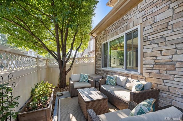 a view of a patio in the backyard