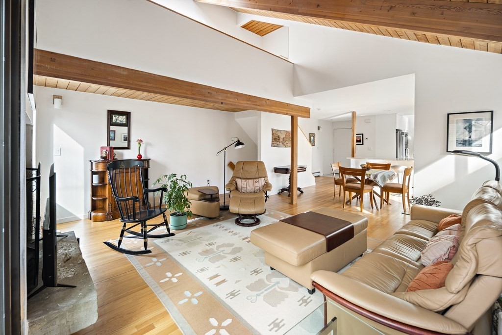 58 Garden Street, Unit F Cambridge, MA 02138 - Photo 12 of 25 a view of a livingroom with furniture and gym equipment