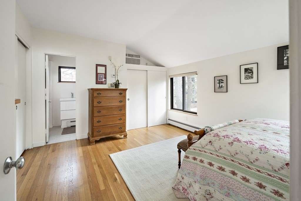 58 Garden Street, Unit F Cambridge, MA 02138 - Photo 14 of 25 a bedroom with a bed and wooden floor