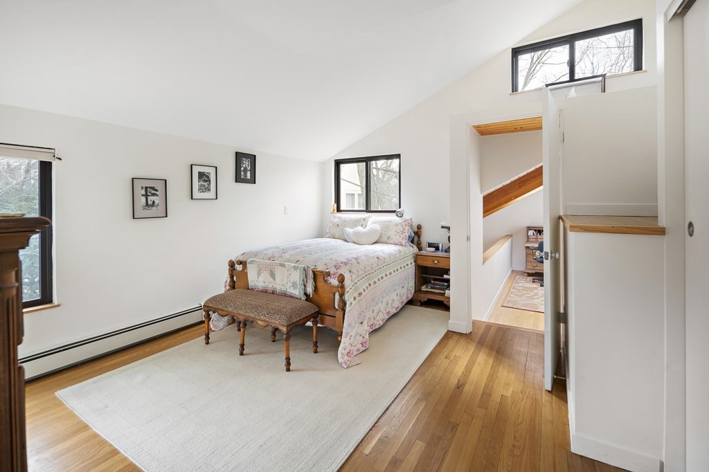 58 Garden Street, Unit F Cambridge, MA 02138 - Photo 16 of 25 a bed room with a bed and a chair