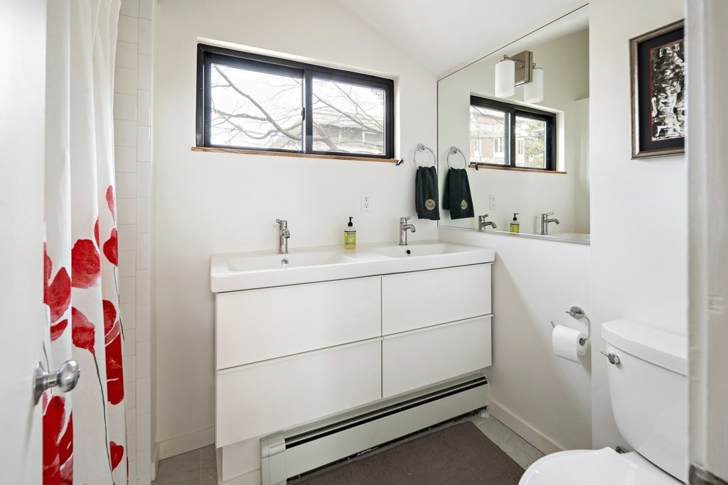 58 Garden Street, Unit F Cambridge, MA 02138 - Photo 17 of 25 a bathroom with a sink toilet and mirror