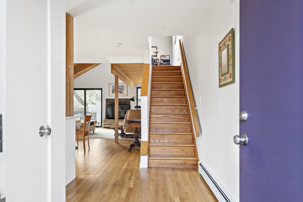 58 Garden Street, Unit F Cambridge, MA 02138 - Photo 3 of 25 a view of a living room with furniture and wooden floor