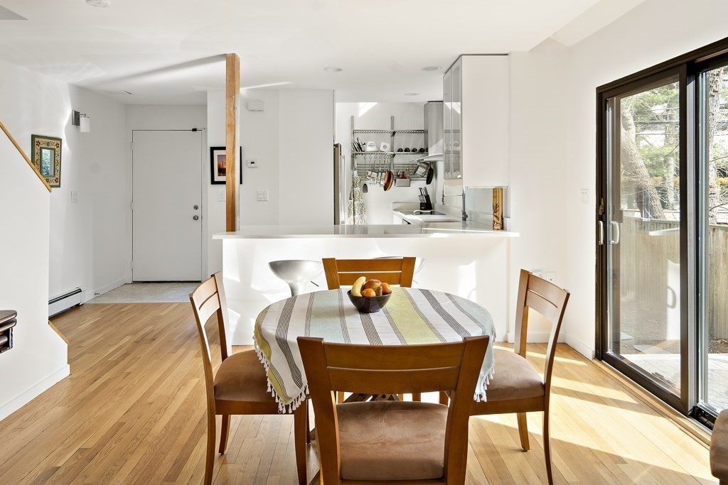58 Garden Street, Unit F Cambridge, MA 02138 - Photo 9 of 25 a view of a dining room with furniture and wooden floor