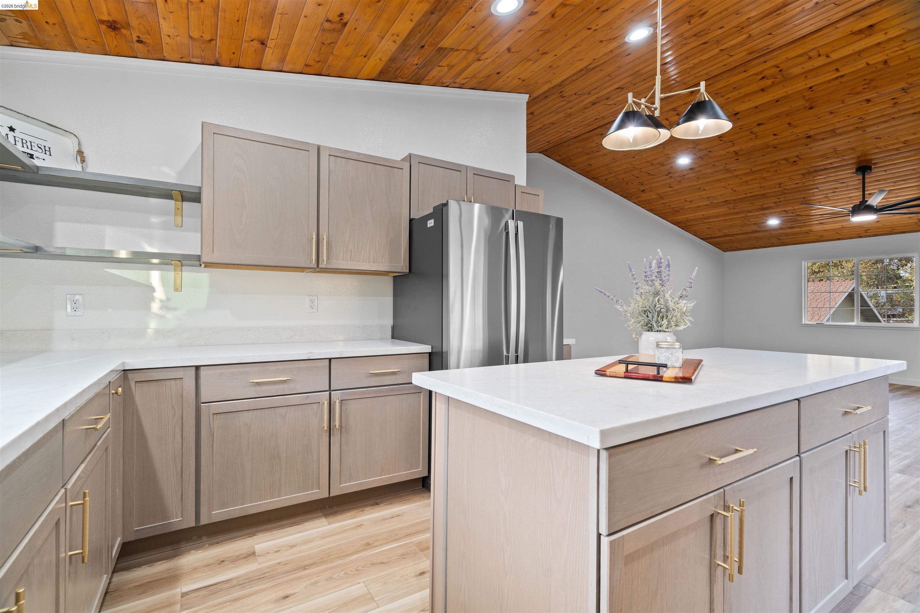 19676 Rawhide Road Sonora, CA 95370 - Photo 19 of 67 Vaulted wood-paneled ceiling, recessed lighting, and a contemporary pendant fixture
