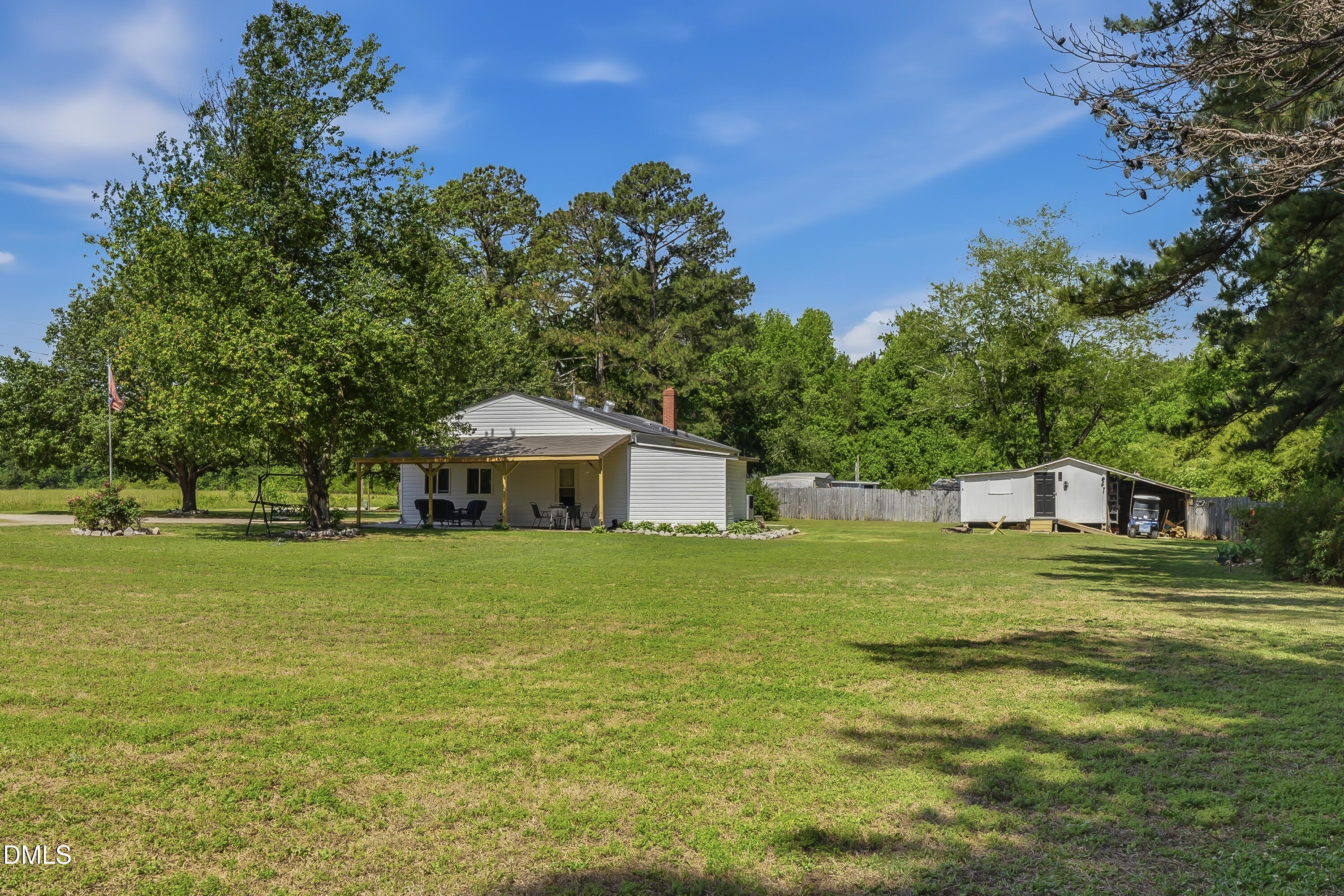 4967 Highway 581 Spring Hope, NC 27882 - Photo 13 of 44 a front view of a house with a yard