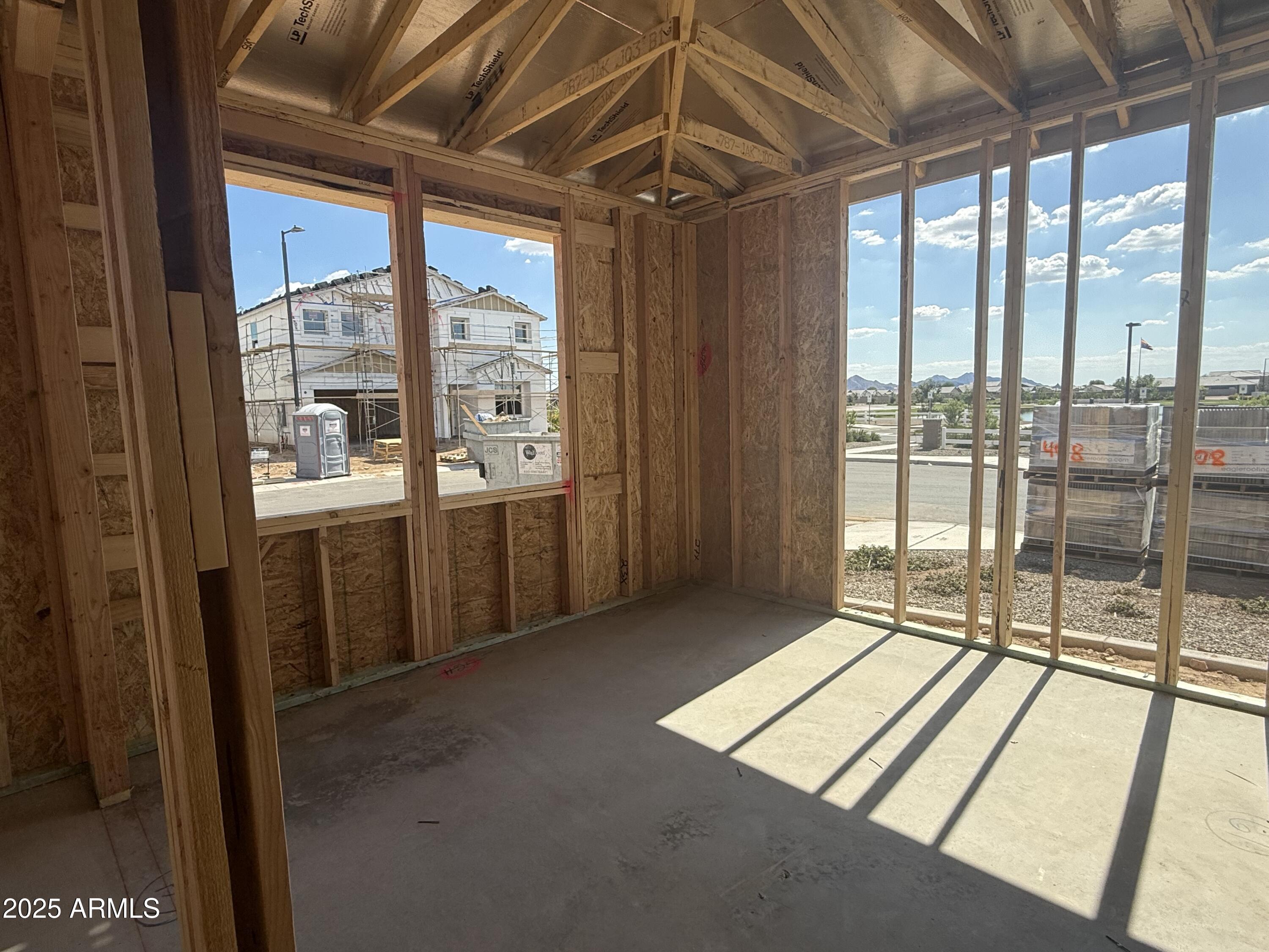 2336 Homesteaders Road San Tan Valley, AZ 85140 - Photo 5 of 38 a view of an empty room with a window