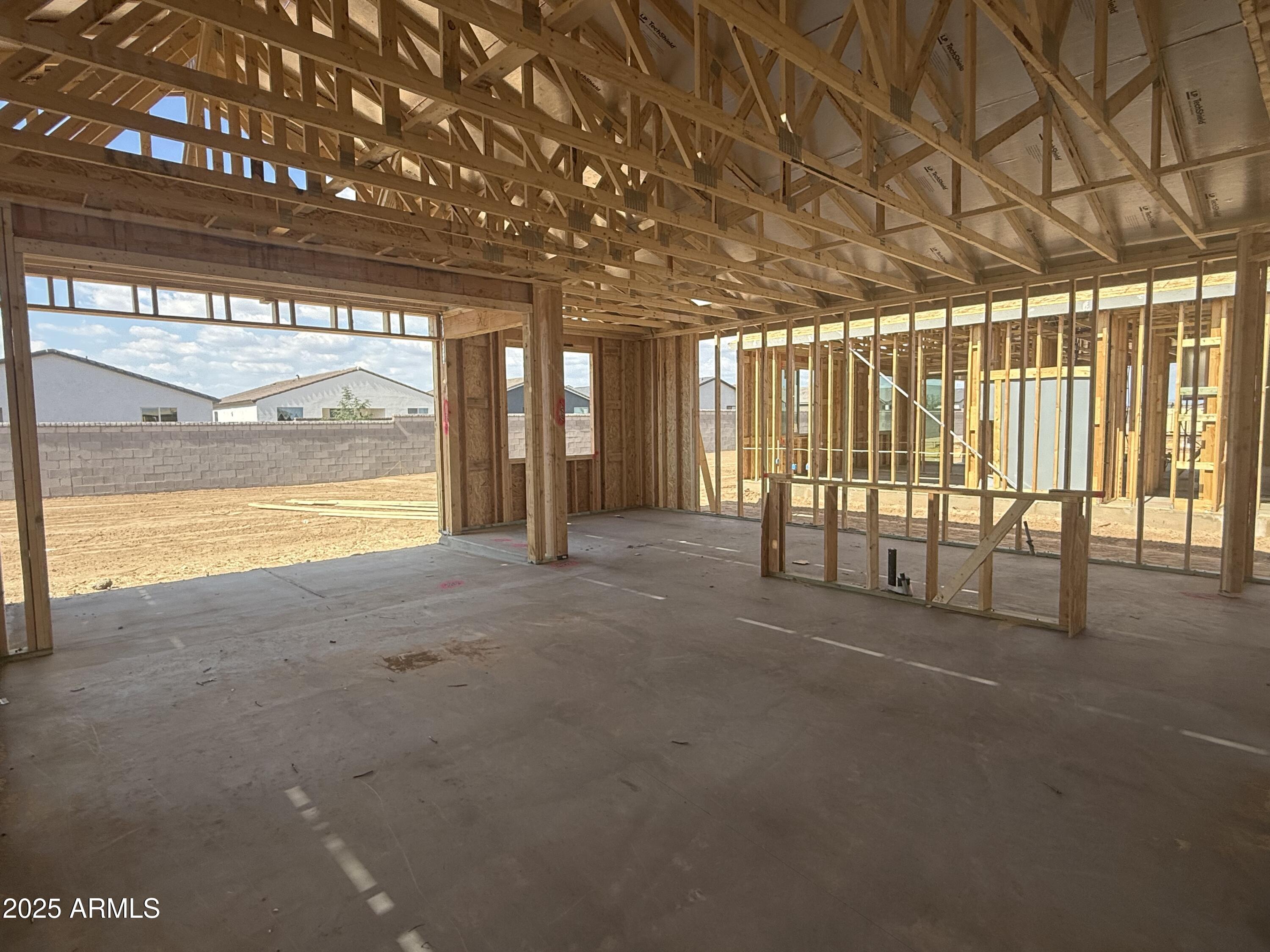 2336 Homesteaders Road San Tan Valley, AZ 85140 - Photo 8 of 38 a view of an empty room with a sliding door
