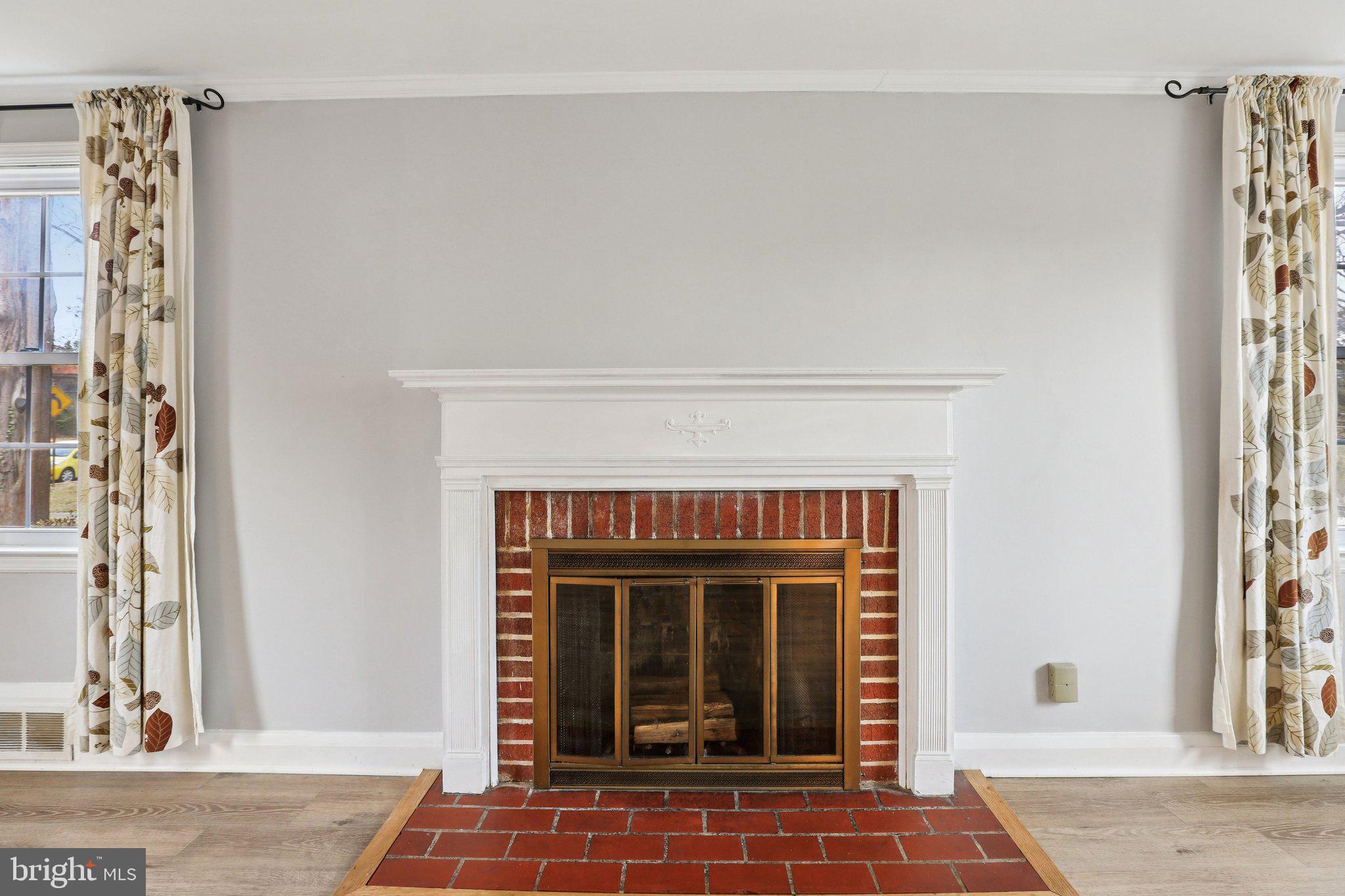 737 Howard Road Baltimore, MD 21208 - Photo 9 of 48 wood burning fireplace in living room