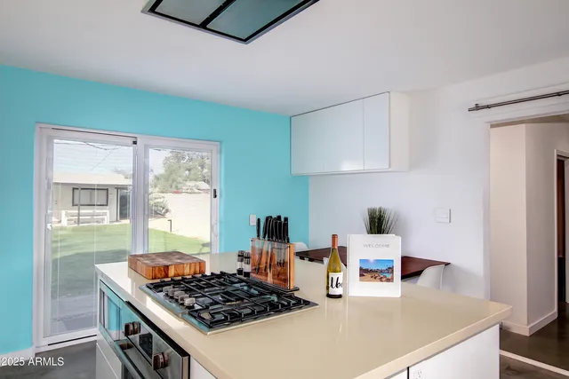 a kitchen with a stove and a refrigerator