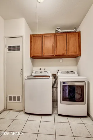 a utility room with washer and dryer