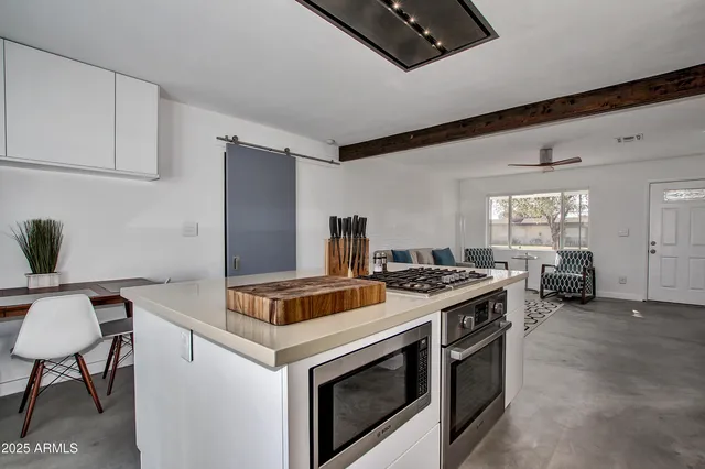 a kitchen with a stove and a microwave
