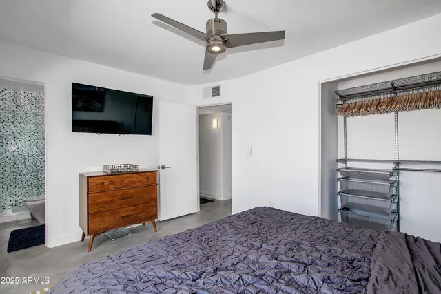 a living room with a flat screen tv and a fireplace