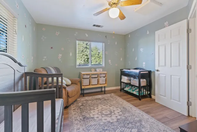 a bedroom with furniture and a window