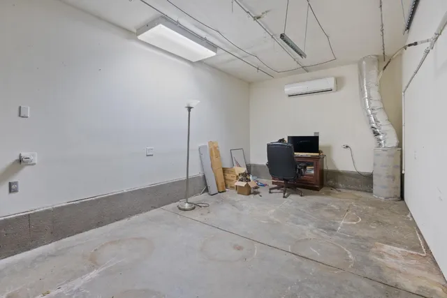 a storage room with furniture and a flat screen tv