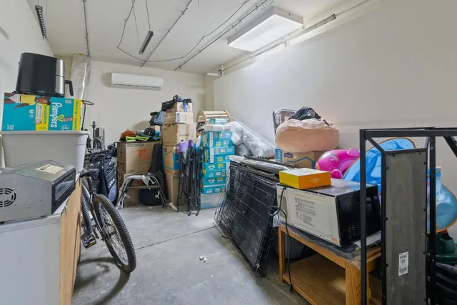 a view of a house with a yard and large tree