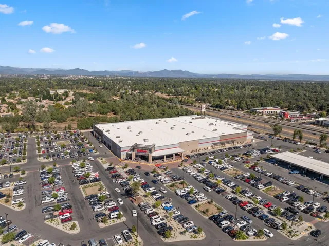 a view of a town with mountains in the background