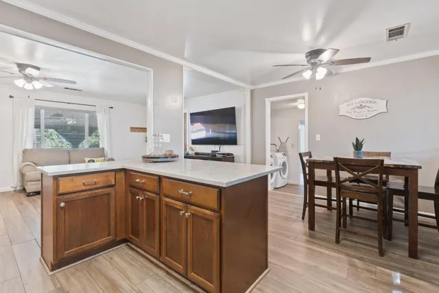 a kitchen with a cabinets a sink and appliances