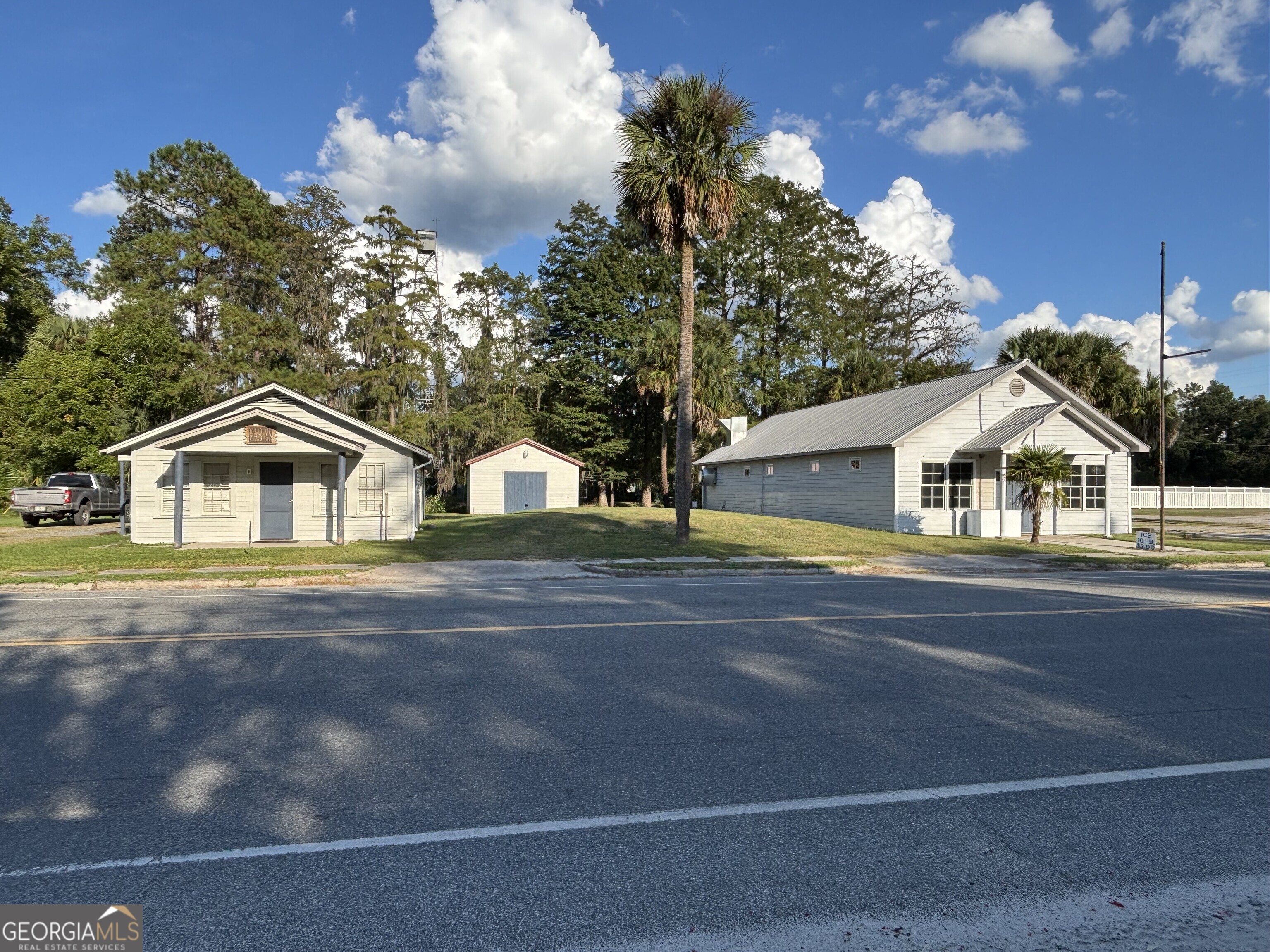 a view of street along with residential houses