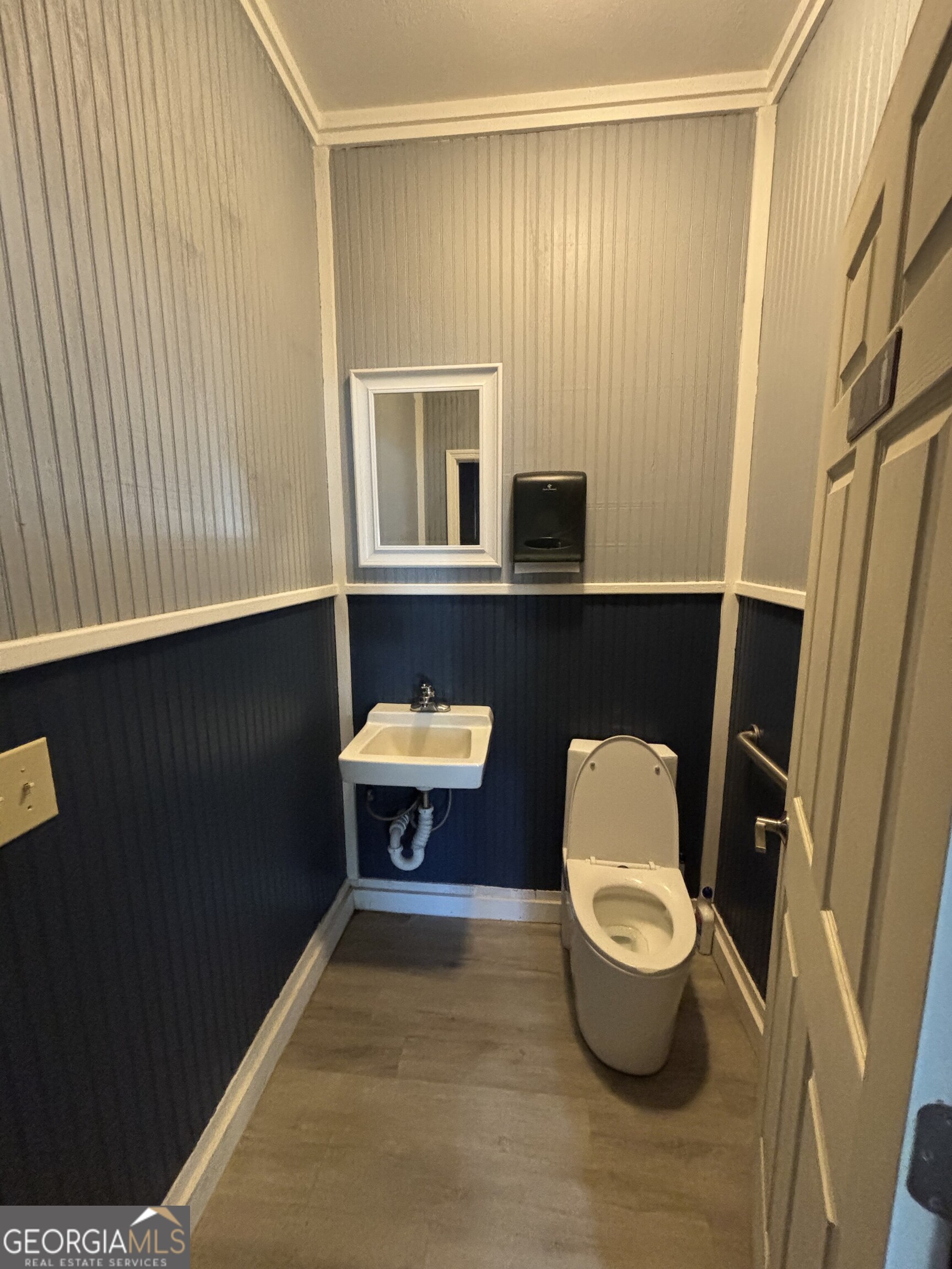 729 Highway 441 Fargo, GA 31631 - Photo 12 of 26 a bathroom with a toilet a sink and mirror