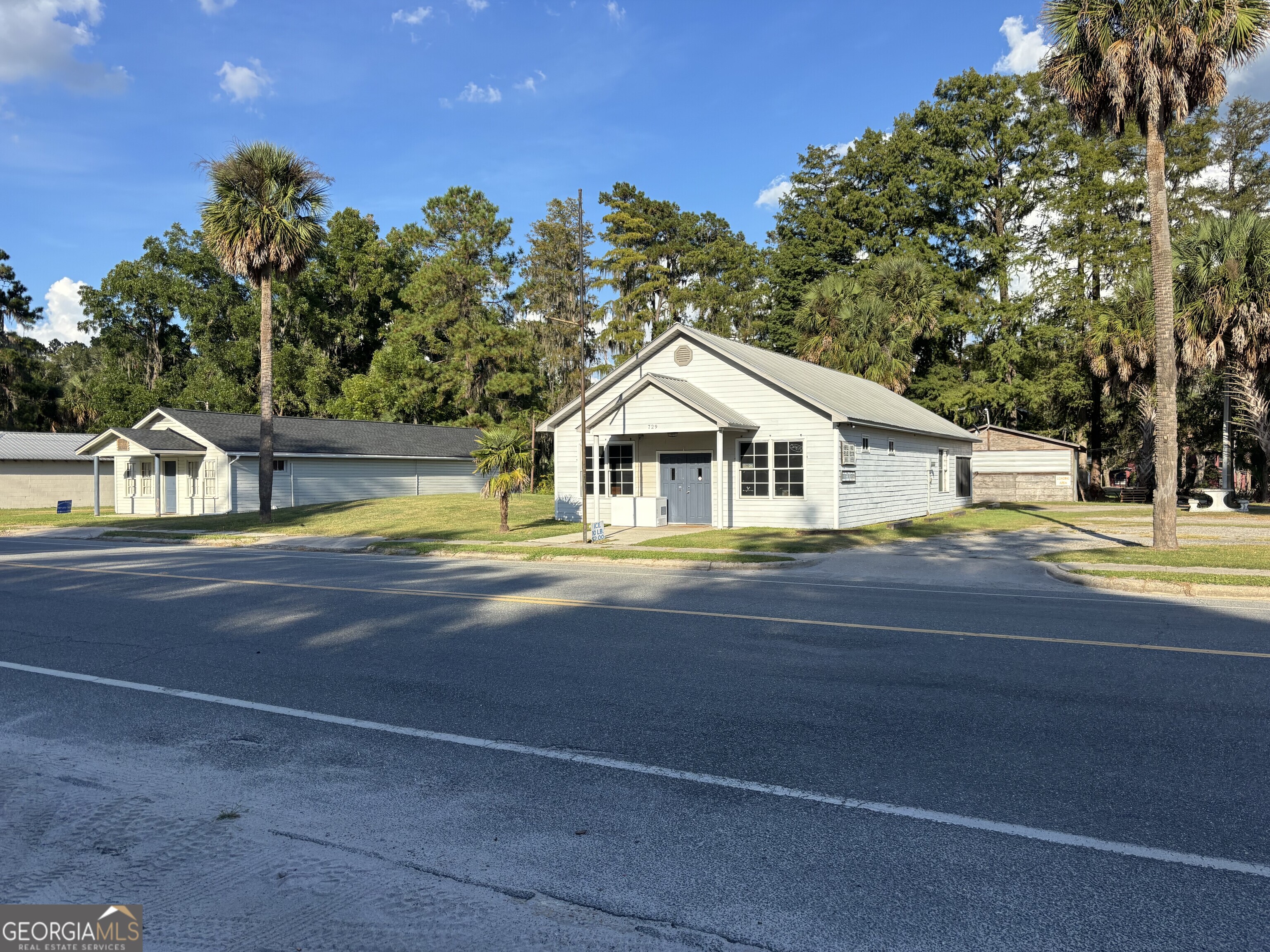 729 Highway 441 Fargo, GA 31631 - Photo 2 of 26 a view of a house with a swimming pool