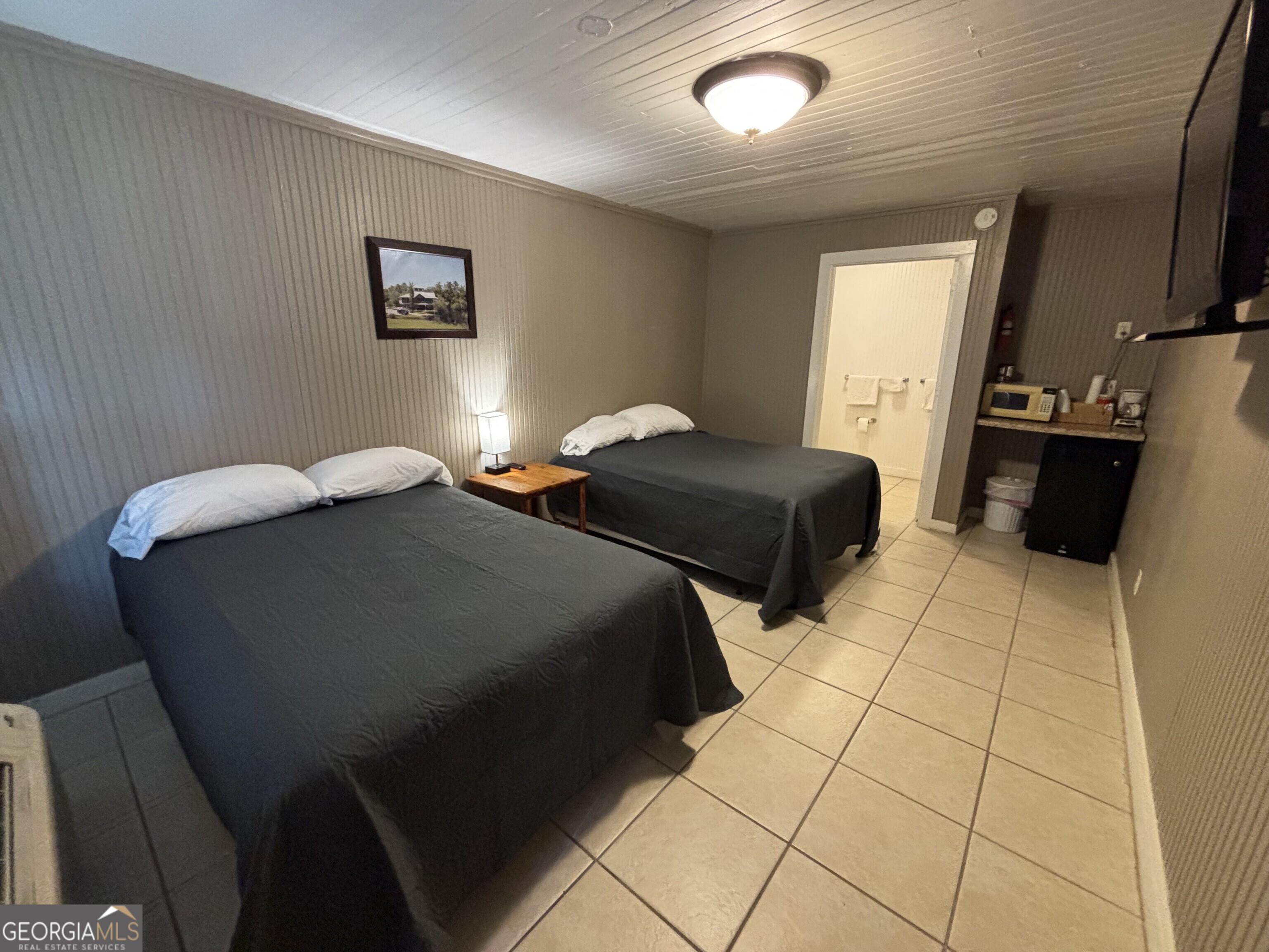 729 Highway 441 Fargo, GA 31631 - Photo 5 of 26 a bedroom with two beds and a mirror