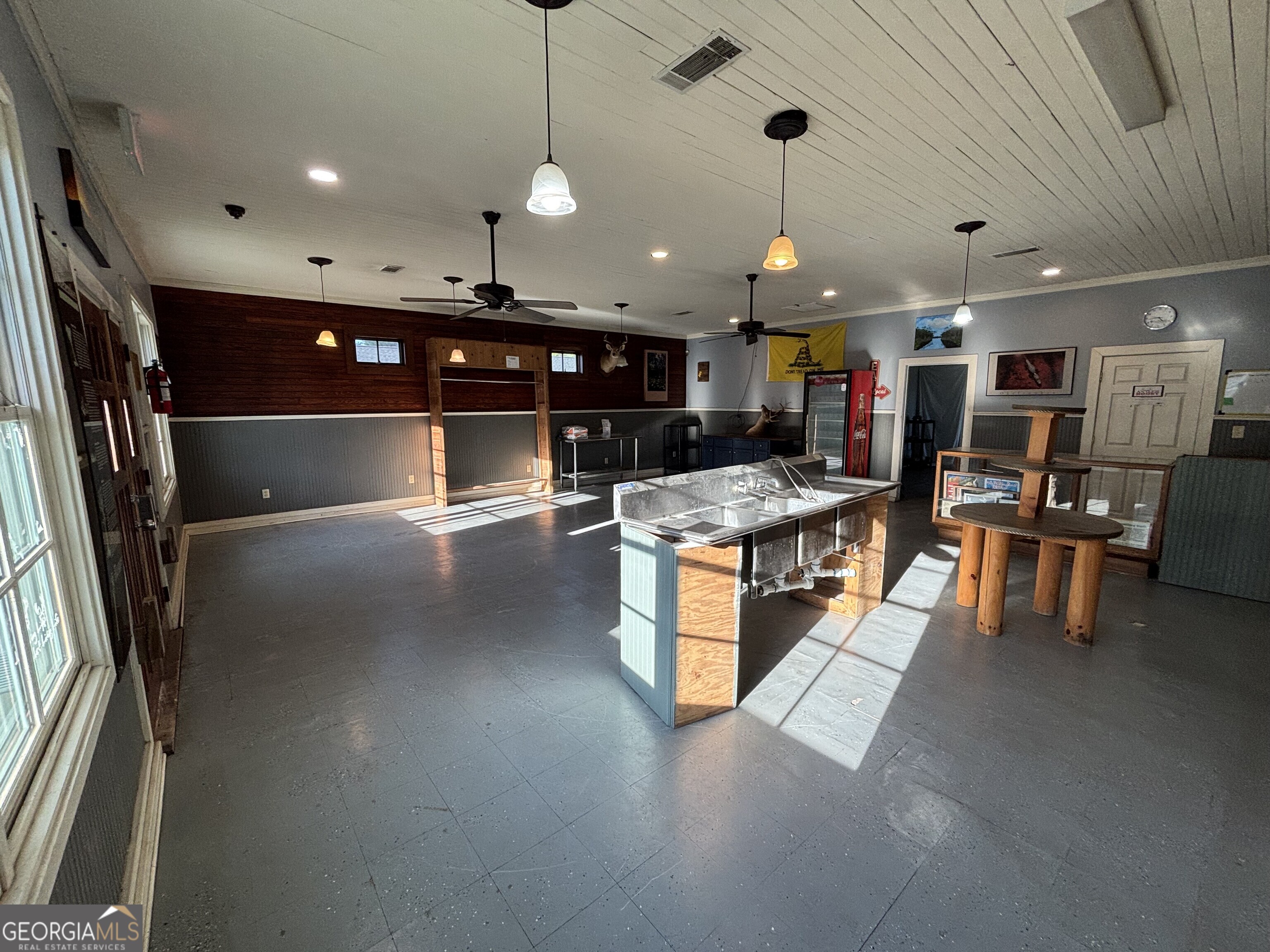 729 Highway 441 Fargo, GA 31631 - Photo 8 of 26 a kitchen with stainless steel appliances granite countertop a sink a stove and a refrigerator