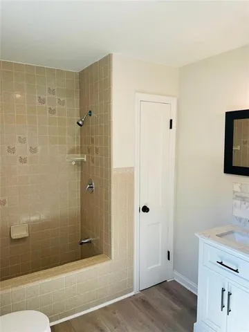 a bathroom with a shower and a sink