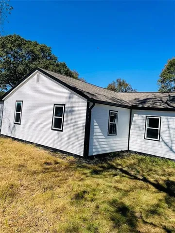 a house with trees in the background