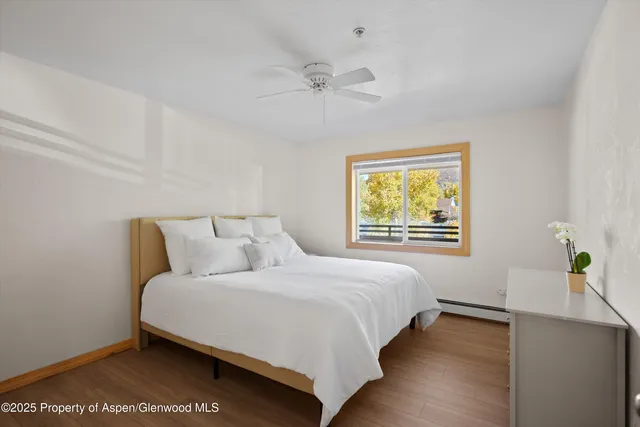 a bedroom with a bed and window