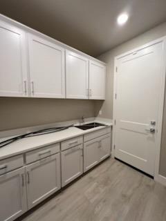 11517 Lagarto Way Rancho Cordova, CA 95742 - Photo 7 of 9 a kitchen with white cabinets and white appliances