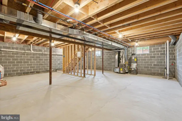 a view of empty room with wooden ceiling