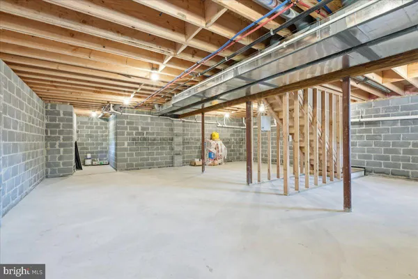 a view of empty room with wooden walls