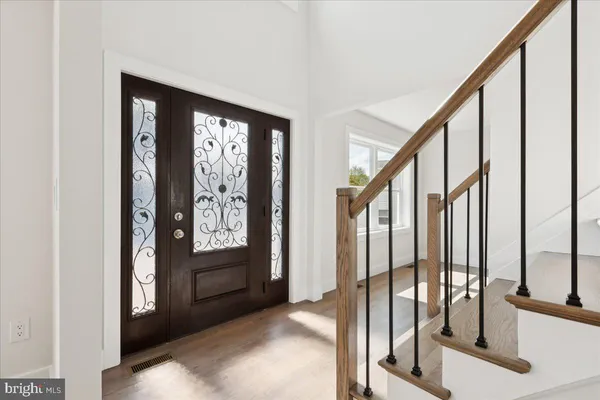 a view of an entryway with a hallway