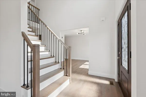 a view of staircase with white walls and windows