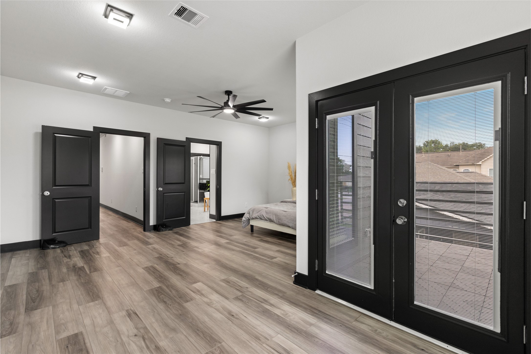 4435 Maggie Street, Unit B Houston, TX 77051 - Photo 21 of 37 You'll love the abundant natural light from large French doors leading to a balcony. The room includes two doorways for convenient access to adjoining areas.