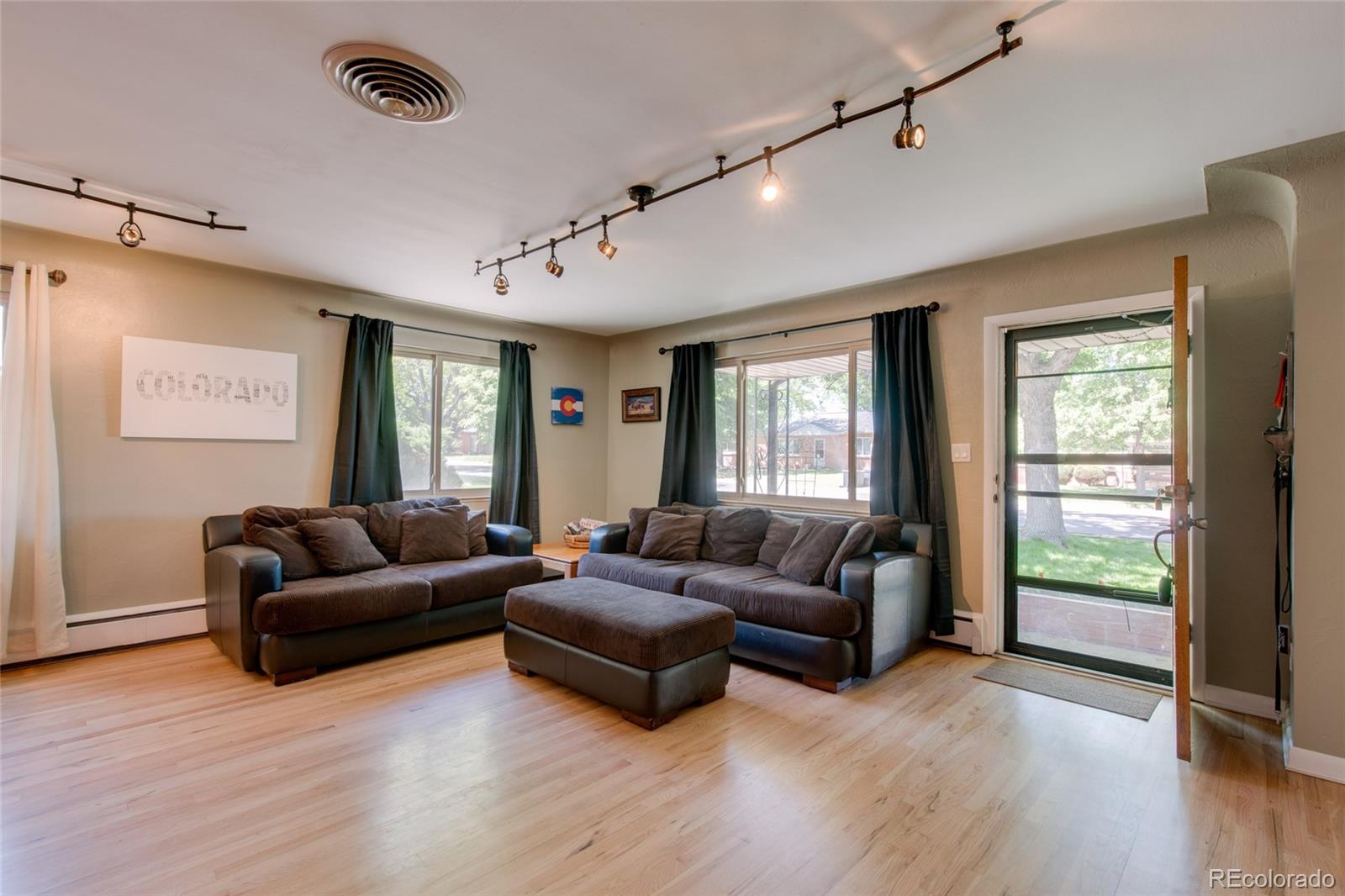 4460 Reed Street Wheat Ridge, CO 80033 - Photo 6 of 35 a living room with furniture and a large window