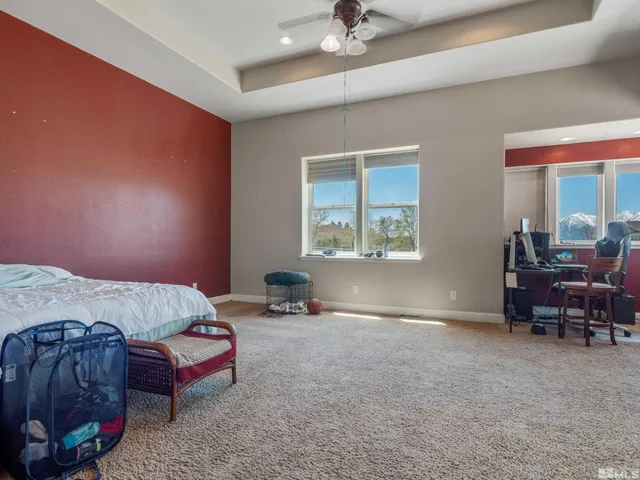 a bedroom with furniture and a window