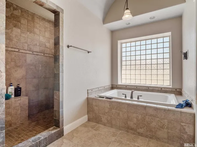 a bathroom with a bathtub and a toilet