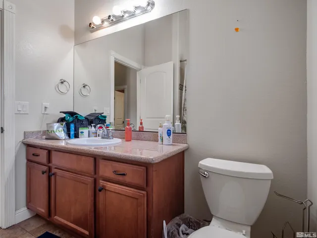 a bedroom with two beds and a dresser