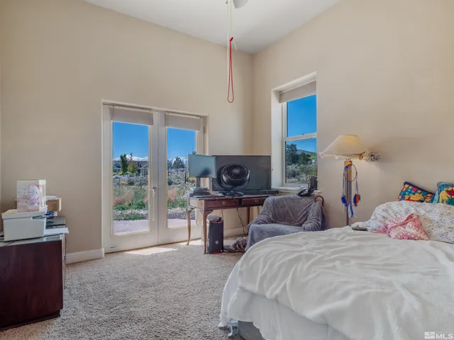 a bed room with a bed and a couch